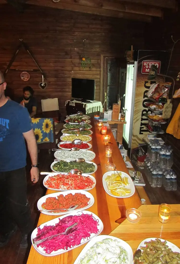 Buffet table with salads and meze plates in the camp restaurant